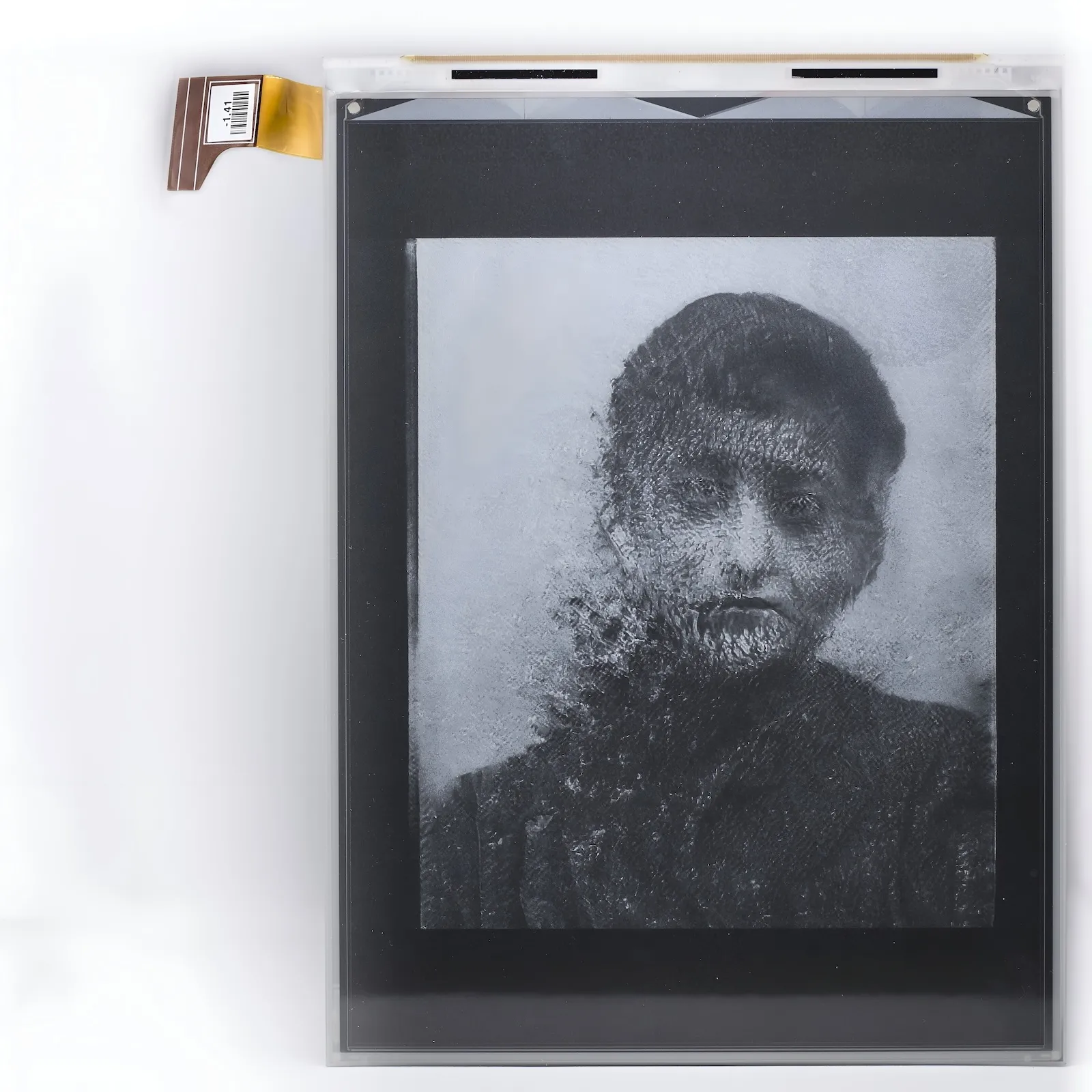 Retained Reports — GAN-hallucinated computational portraits on powered-off electronic-ink, installation view.